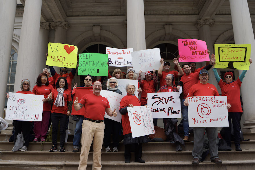 Senior Planet members gather on the steps of New York City Hall