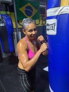 senior woman in boxing gym