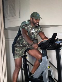 senior man on exercise bike